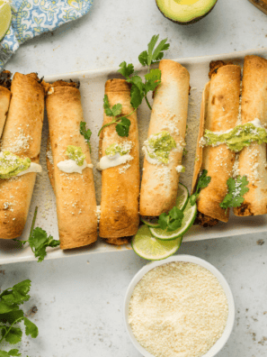 Crispy bean and cheese air fryer taquitos on a plate with salsa