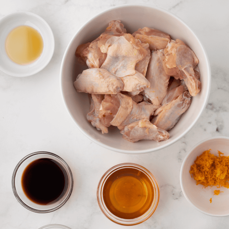 Ingredients needed for Gluten-Free Chicken Wings Recipe on kitchen table.
