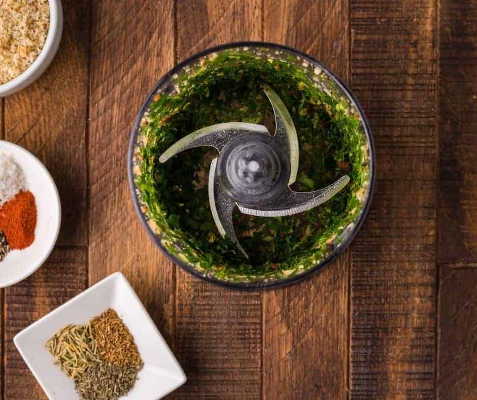 Herbs in a blender for cooking rack of lamb