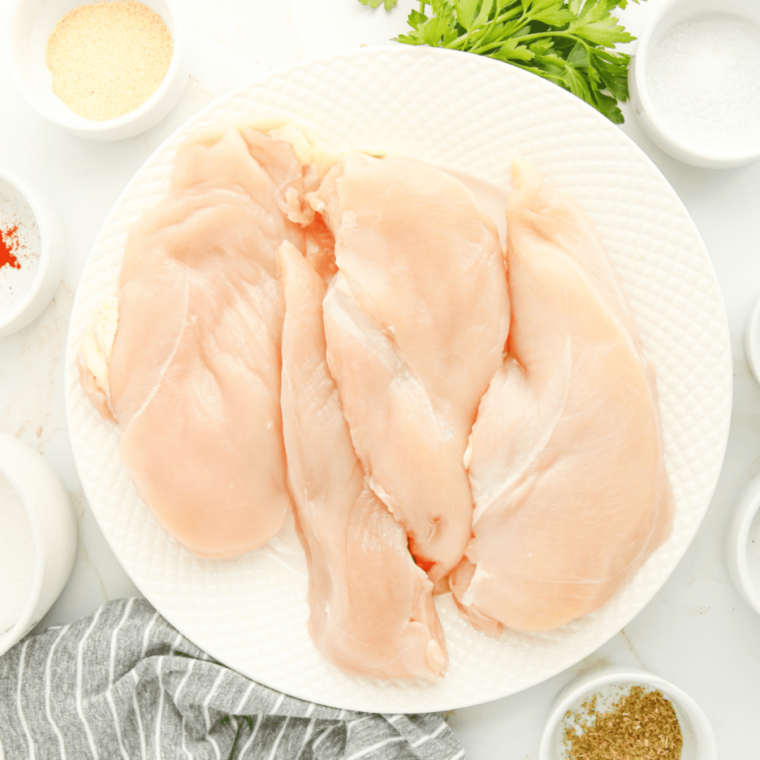 Ingredients needed for Air Fryer Butterflied Chicken Breast on kitchen table.