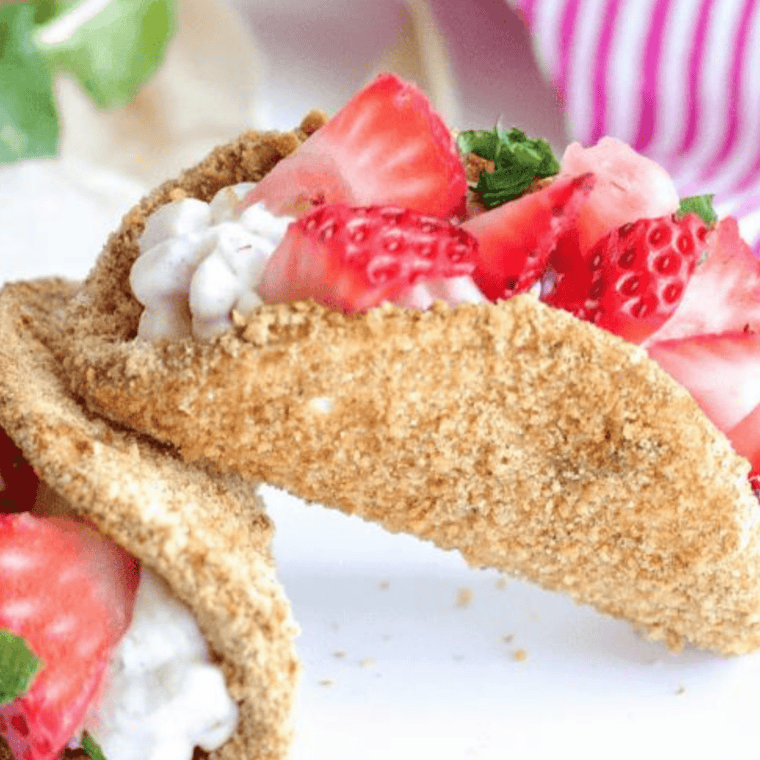 Easy air fryer cheesecake strawberry tacos &mdash; crispy graham shells with strawberry cheesecake filling