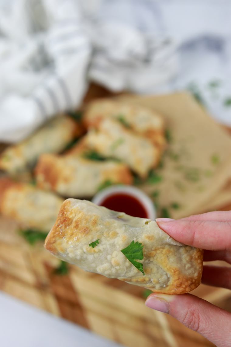 Plate of golden, crispy Air Fryer Chicken Cilantro Egg Rolls ready to be served.