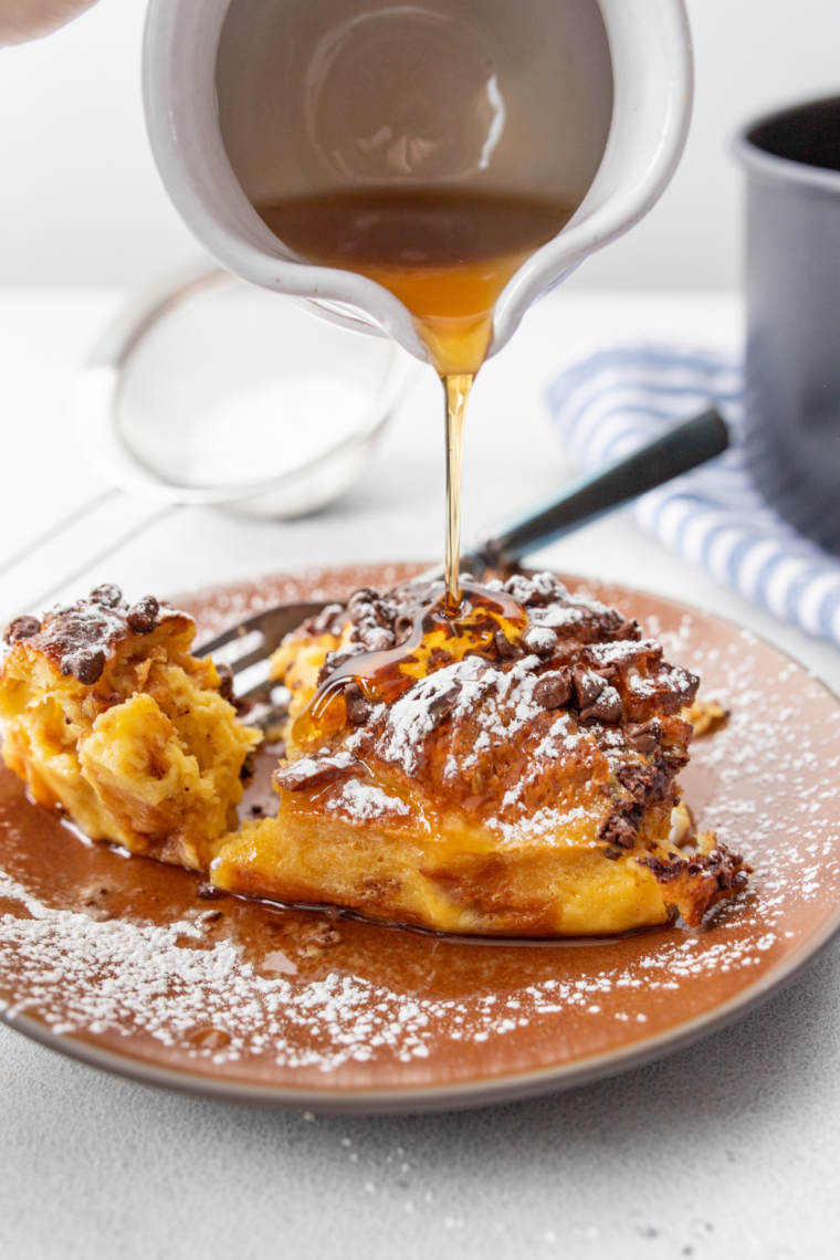 Air fryer chocolate chip French toast casserole with golden baked bread and melted chocolate chips on top