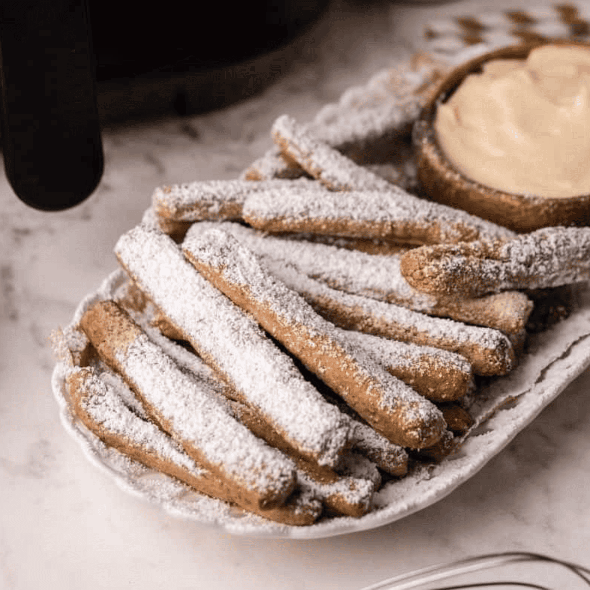 Air Fryer Funnel Cake Fries are a fun, crispy twist on the classic fair treat, made quickly and easily in your air fryer. These golden, crunchy fries are dusted with powdered sugar for the perfect sweet snack or dessert. With minimal oil and fast cooking, they’re a lighter and healthier way to enjoy funnel cake at home!