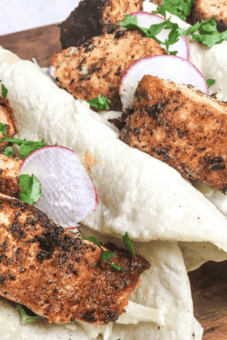 Golden blackened cod fillet cooked in an air fryer, flaky and seasoned