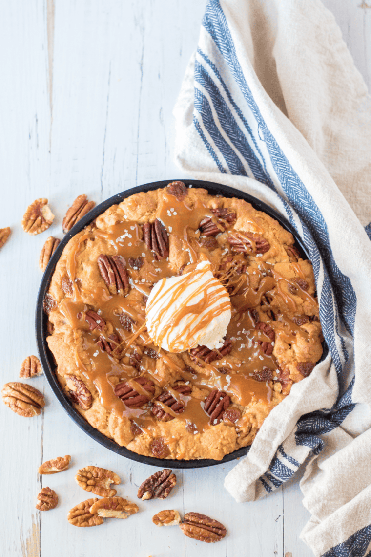Giant Caramel Pecan Air Fryer Cookie recipe &ndash; soft, chewy, loaded with pecans and caramel, made quickly in your air fryer. Perfect for dessert or an indulgent snack!