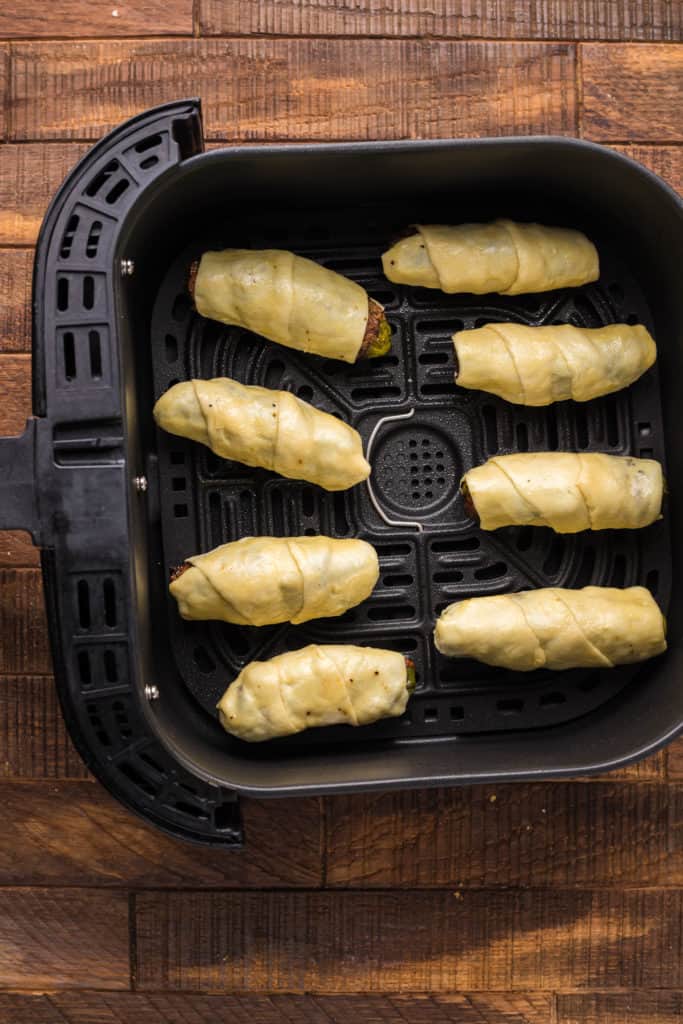 Lightly spray the air fryer basket with nonstick cooking spray. Arrange pickles in a single layer evenly spaced in the basket and cook for 8 minutes, stopping once halfway through to flip. 