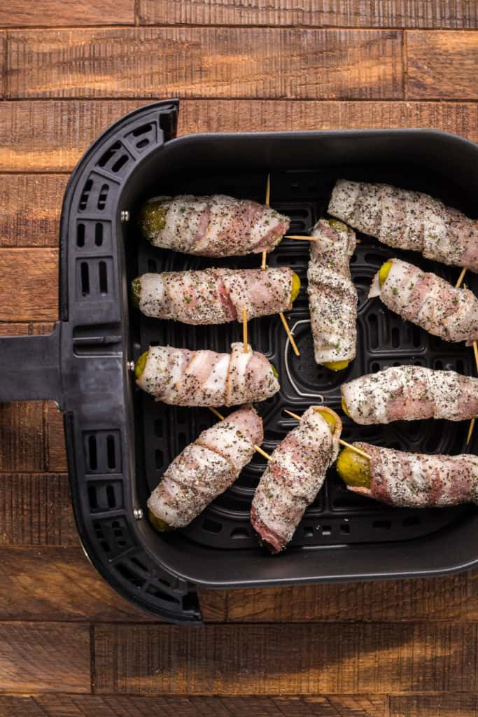 Pickles Wrapped in Bacon in air fryer basket
