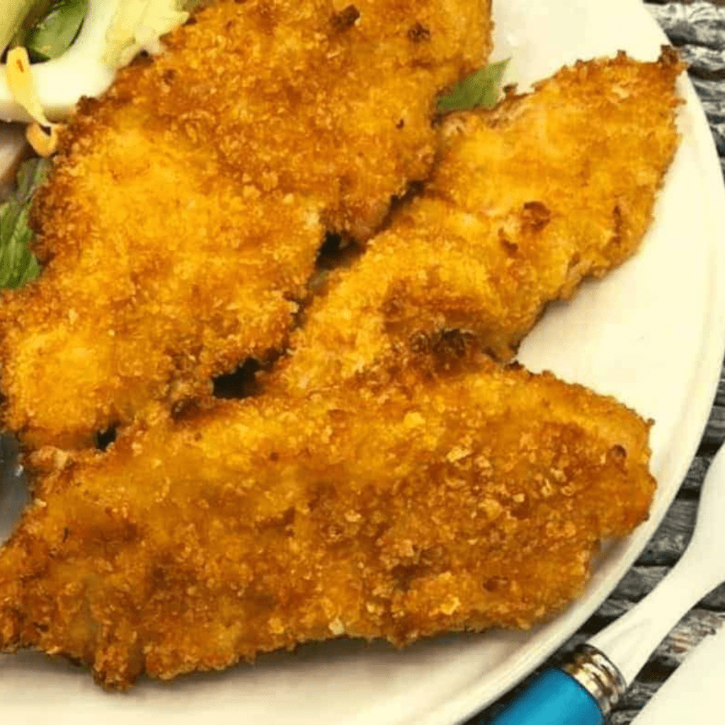 Who doesn't love a great family favorite recipe? Today, we made a simple recipe for air fryer cornflake chicken tenders which is deloisu and easy to prepare. If you have been looking for an easy weeknight chicken dinner that the whole family will love, this one is the best, and of course, made in your air fryer, it's simple and delicious! 



This is such an easy recipe, if you love tradition fried chicken, or are just a chicken lover, this is the perfect recipe for you, and it will show you the magic of an air fryer!



Air Fryer Cornflake Chicken
​

If you are looking for a delicious and crispy chicken recipe, look no further than this Air Fryer Cornflake Chicken recipe. This recipe takes the classic chicken tender to the next level by using cornflakes as a coating to create a crunchy and flavorful crust. With the help of an air fryer, you can cook the chicken to perfection without the need for deep-frying, making it a healthier and more convenient option. This recipe is simple, easy to follow, and sure to be a hit for kids and adults alike. Let's get started on this tasty and satisfying recipe.

​

Why You Will Love Air Fryer Chicken Tenders Corn Flakes
​There are many reasons why you will love Air Fryer Chicken Tenders Corn Flakes:

They are crispy: The cornflake coating gives the chicken tenders an irresistible crispy and crunchy texture. Crispy air fryer chicken tenders, what's better?

They are healthier: Cooking chicken tenders in an air fryer eliminates the need for deep-frying, making them a healthier option that is lower in calories and fat.

They are easy to make: This recipe is simple and easy to follow, making it a great option for busy weeknights or when preparing a quick and delicious meal.

They are customizable: You can add your favorite seasonings and spices to the cornflake coating to make it your own and add extra flavor.

They are versatile: Air Fryer Chicken Tenders Corn Flakes can be served as a snack, an appetizer, or as a main dish, and they pair well with a variety of dipping sauces and side dishes.

They are kid-friendly: Kids love crispy chicken tenders, and this recipe will surely be a hit with even the pickiest eaters. A great meal that the entire family will love! 

Overall, Air Fryer Chicken Tenders Corn Flakes are a delicious, healthier, and easy-to-make option that will surely become a favorite in your household.



Ingredients Needed For Air Fryer Cornflake Chicken Tenders
​

If you're looking for an easy weeknight dinner requiring minimal prep and ingredients, look no further than Air Fryer Cornflake Chicken Tenders! Not only are they incredibly delicious and perfect as a main dish or side, but they also require six simple pantry staples - making them the ultimate crowd-pleasing meal that can be whipped up in minutes. Perfectly crunchy on the outside and juicy on the inside, these tenders will surely have everyone returning for more.



Remember the step-by-step directions are below in the printable recipe card at the bottom of the page, as well as the nutritional information.  

​

Chicken: Use boneless, skinless chicken breasts, chicken strips, or chicken tenderloins, or boneless, skinless chicken tenders

Egg: Use large, room-temperature eggs

Milk: Use whole milk, almond milk, or coconut milk

Flour: Use all-purpose flour, gluten-0free all-purpose flour. For keto or low-carb option,  use coconut flour

Cornflakes: Buy crushed cornflakes, or a box or Cornflakes

Seasonings and Spcie: Kosher Salt, and Black Pepper

Cooking Spray: Use non-stick cooking spray, or olive oil



How To Cook Cornflake Chicken Tenders In Air Fryer
​

What could be better than enjoying some crunchy and delicious chicken tenders for dinner? How about making them in the air fryer with a cornflake crisp coating? Below, we'll go over all the steps required to make perfect Cornflake Chicken Tenders using an air fryer. 



Step One:  Preheat the air fryer

Spray your air fryer basket with olive oil spray. Preheat your air fryer at 350 degrees F for 3-5 minutes, air fryer setting.

Step Two:  Prepare Dredging Stations

Mix the egg, milk, flour, salt, and black pepper in a resealable bag or shallow bowl. Add the cornflakes to a food processor and process until you have fine crumbs. If you do not have a food processor, add the Box of Corn Flakes into a zip top bag, and using a rolling pin, crush the cornflakes until you have cornflake crumbs.  Add the crushed cornflakes to a small bowl or shallow dish.

Step Three: Bread Your Chicken

Place chicken pieces into the egg mixture and then the cornflake mixture. Press the cornflakes onto the chicken so it’s fully covered.

Step Four: Air fryer Cornflake Chicken tenders

Place chicken tenders into the air fryer basket in a single layer, spraying them with olive oil, and then set the timer for 5 minutes. Flip, spray again, and air fry for another 3 to 5 minutes.

​Step Five: Serving

Serve with your favorite dipping sauce. 



Pro Tips



Use a food processor: Cushing the cornflakes into fine crumbs will result in a more even coating and a crispier texture.

Season the chicken: Season the chicken tenders with salt, pepper, and other seasonings or spices before coating them in the cornflakes. Try garlic powder, onion powder, or Italian seasoning. 

Preheat the air fryer: Preheat the air fryer for a few minutes before cooking the chicken tenders. This will help to ensure that they cook evenly and come out crispy.

Don't overcrowd the air fryer: Don't overcrowd the air fryer basket with too many chicken tenders at once. This will prevent the hot air from circulating properly, resulting in uneven cooking and a less crispy texture.

Spray with cooking spray: Spray the chicken tenders with cooking spray before cooking to help them brown and become crispy.

Shake the basket: Shake the basket a few times during cooking to ensure that the chicken tenders cook evenly and are evenly coated in the cornflake coating.

Use a meat thermometer: Use a meat thermometer to check the internal temperature of the chicken tenders. The chicken tenders should be cooked to an internal temperature of 165°F (74°C) to ensure they are fully cooked and safe to eat.

Serve immediately: Chicken tenders are best served hot and crispy, so serve them immediately after they come out of the air fryer for the best texture and flavor.



What To Serve With Air Fryer Cornflake Chicken Tenders
​

Air Fryer Cornflake Chicken Tenders are a versatile dish that can be served with various side dishes and dipping sauces. Here are some of my favorite side dishes to serve with Cornflake Chicken. 

French Fries: Serve the chicken tenders with a side of crispy french fries for a classic and satisfying meal.

Coleslaw: Coleslaw is a refreshing side dish that pairs well with chicken tenders. You can make a classic coleslaw or try a variation with apples, raisins, or nuts.

Roasted Vegetables: Roasted vegetables, such as broccoli, carrots, green beans, or sweet potatoes, are a healthy and delicious side dish that complements the crispy texture of the chicken tenders.

Mashed Potatoes: Creamy and comforting mashed potatoes are perfect for chicken tenders. You can also add some garlic or cheese to the mashed potatoes for extra flavor.

Mac and Cheese: Rich and cheesy mac and cheese is a comforting side dish that pairs well with crispy chicken tenders.

Salad: A fresh and crisp salad is a healthy and light side dish that balances the richness of the chicken tenders. Try a salad with mixed greens, tomatoes, cucumbers, and a tangy vinaigrette.

You can create a delicious and satisfying meal that everyone will enjoy by pairing Air Fryer Cornflake Chicken Tenders with various side dishes and dipping sauces.



storing Leftover Chicken Cornflake ChickencTenders
Let the chicken tenders cool to room temperature before transferring the coated tenders to an airtight container or plastic bag. They will last in the refrigerator for 2-3 days.

​

Frequently Asked Questions​
Can I use a different type of cereal for the coating? 

Yes, you can use different types of cereal, such as Rice Krispies or Corn Chex, to make the coating. However, cornflakes work best because of their texture and crunchiness. They are a great alternative to bread crumbs. 

Can I use bone-in chicken instead of chicken tenders? 

Yes, you can use bone-in chicken pieces instead of chicken tenders. However, the cooking time will be longer, and you may need to adjust it accordingly to ensure that the chicken is cooked through and crispy. Another great option is chicken thighs, boneless. 

Can I make the chicken tenders ahead of time? 

While it's best to serve the chicken tenders immediately after they come out of the air fryer, you can make them ahead of time and reheat them in the air fryer or oven. However, they may not be as crispy as when they are freshly cooked.

Can I freeze the chicken tenders?

Yes, you can freeze the chicken tenders after coating them in the cornflakes. Place them on a baking sheet lined with parchment paper and freeze for a few hours. Once frozen, transfer them to a freezer-safe container or bag and store them for up to three months. To cook, preheat the air fryer and cook the chicken tenders straight from the freezer, adding a few minutes to the cooking time.

What dipping sauces pair well with Air Fryer Cornflake Chicken Tenders? 

You can pair the chicken tenders with your favorite dipping sauce, such as homemade ranch dressing, hot sauce, honey mustard, or barbecue sauce. You can also try making your own dipping sauce by mixing mayo, Greek yogurt, or sour cream with different seasonings and spices.

By answering these frequently asked questions, you can make delicious and crispy Air Fryer Cornflake Chicken Tenders that will surely be a hit with your family and friends.

​