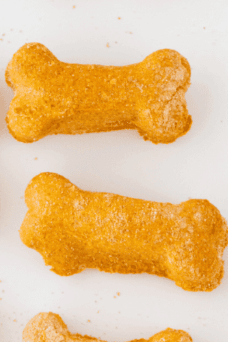 Freshly baked homemade dog treats cooling on a wire rack, made in the air fryer