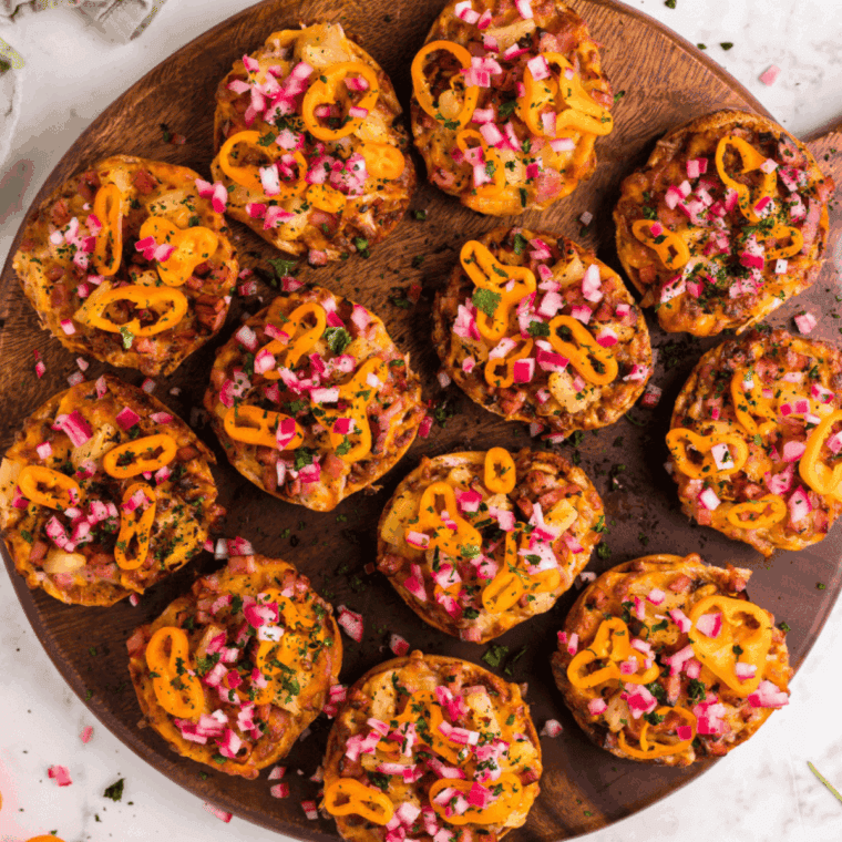 Crispy gluten-free pizza bagels fresh from the air fryer, topped with melted cheese and savory pizza toppings.