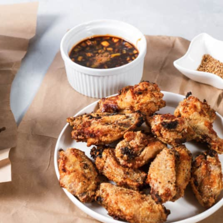 Close-up of crispy Air Fryer Korean Chicken Wings coated in a flavorful glaze"