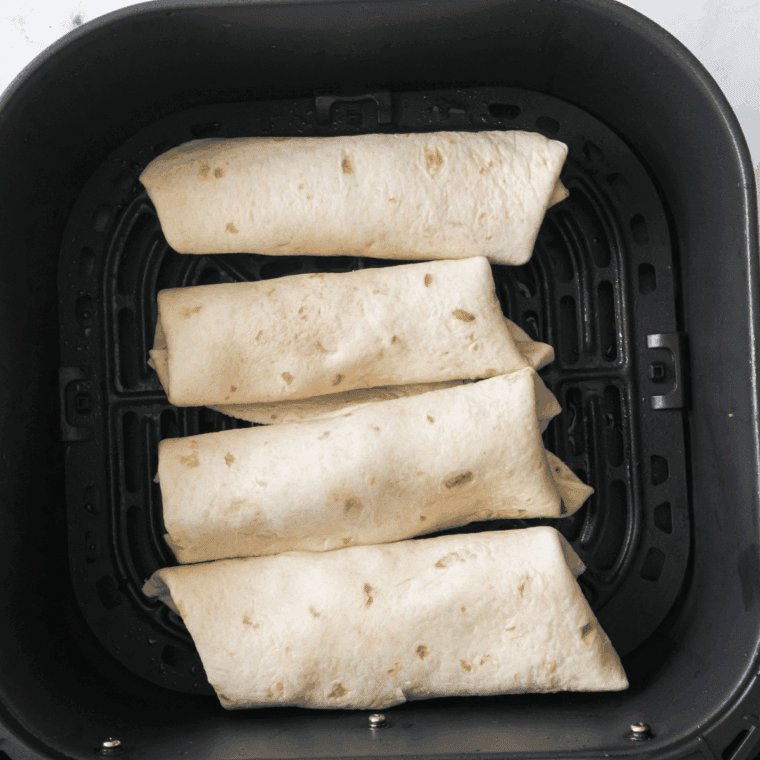 Rolling tortillas with filling, folding edges, brushing with oil, and preparing chimichangas for air frying.
