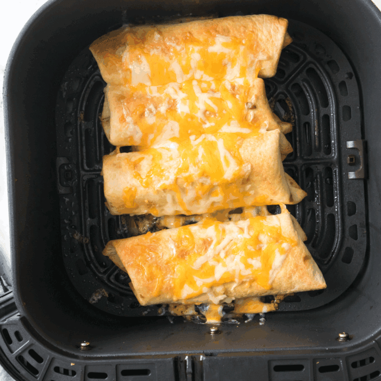 Placing chimichangas seam-side down in the air fryer basket, cooking at 390°F for 5-6 minutes, then adding cheese for the final minute.