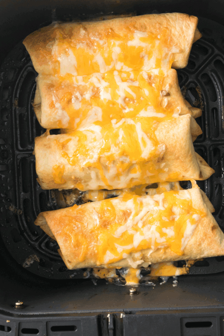 Air Fryer Shrimp Chimichangas, golden and crispy with shrimp, cheese, and rice, ready to serve with salsa or sour cream.