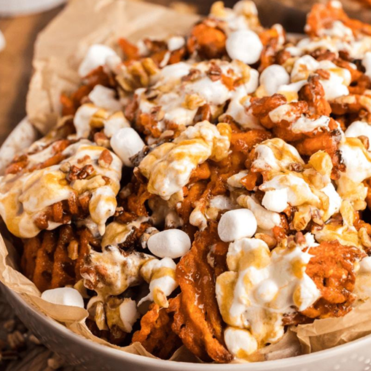 Plate of gooey sweet potato nachos in air fryer