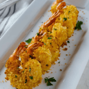 Who doesn't love Air Fryer Bang Bang Shrimp? This is a popular item and the best air fryer copycat recipe from Bonefish Grill; it is perfectly cooked breaded shrimp, with a signature sweet chili sauce, over the top; it's amazing! Served as a main dish or a great appetizer, this recipe will aim to please, and it might be one of the best things you cook in your air fryer.