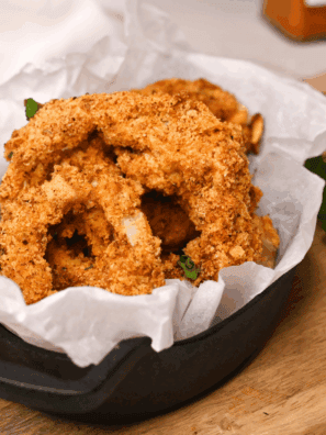 Crispy golden copycat Culver&rsquo;s onion rings stacked on a plate, ready to serve