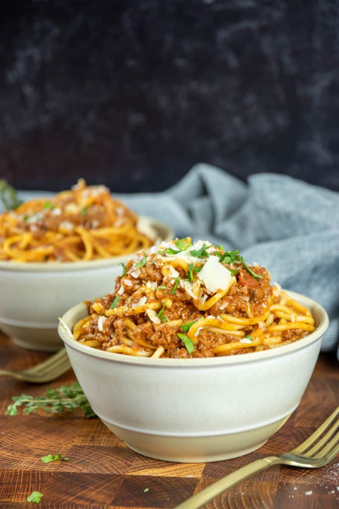 I love this recipe; I make it about every week. My kids, two teenage boys, can eat and eat, which is the perfect meal for them. I usually pair it with a salad and some air fryer garlic bread, and you have an authentic budget-friendly meal.

My mother could not believe how well the spaghetti was done in the Instant Pot; she comes from Italy. So, you know she has some experience with spaghetti! 

The main benefit of making spaghetti in the Instant Pot is that you do not have to watch it, perfect for busy weeknights. It cooks itself. And if you are like me, a busy mom, you need all the help you can get with dinnertime.



Can You Cook Spaghetti In Instant Pot?
​

You can cook spaghetti in an Instant Pot, a versatile kitchen appliance that can pressure cook, sauté, steam, and more. Cooking spaghetti in an Instant Pot is a quick and convenient way to make a satisfying meal. By simply adding spaghetti, water, olive oil, and salt to the pot, you can cook the pasta in just 8 minutes under high pressure. Once the cooking time is up, you can quickly release the pressure and open the lid to perfectly cooked spaghetti ready to be served with your favorite sauce. The cooking time can be adjusted to your preference, making achieving your desired level of doneness easy. Overall, using an Instant Pot to cook spaghetti is an excellent option for anyone looking for a quick and easy way to make a delicious and satisfying meal.



​Why Cook Spaghetti In a Pressure Cooker?
​

Cooking spaghetti in a pressure cooker, such as an Instant Pot, can be beneficial for a few reasons. Firstly, it can significantly reduce the cooking time compared to cooking spaghetti on a stovetop. This is because pressure cookers use high pressure to cook food quickly, which can reduce the cooking time of spaghetti by half or more. This can be particularly useful when you're short on time or want to prepare a quick and easy meal.

Secondly, cooking spaghetti in a pressure cooker can help lock in the pasta's flavors and nutrients. The high pressure and steam create a sealed environment that allows the pasta to cook in its juices, retaining more of its natural flavor and nutrients. This can result in a more flavorful and nutritious meal.

Finally, cooking spaghetti in a pressure cooker can also be convenient as it allows for a one-pot meal. You can cook the spaghetti and sauce in the pressure cooker, eliminating the need for multiple pots and pans. This can save time on both cooking and cleaning.

Cooking spaghetti in a pressure cooker can be a convenient, time-saving, and flavorful way to prepare this famous pasta dish.

tch How To Make Easy Instant Pot Spaghetti Recipe
