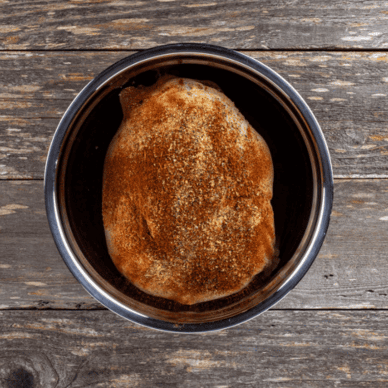 Whole chicken coated with olive oil and seasoning, placed in beer marinade, covered and refrigerated for up to 24 hours.