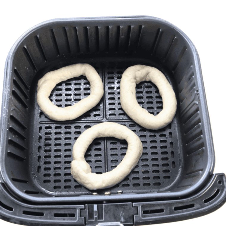 Place the Caramel Stuffed Donuts in the air fryer basket.
