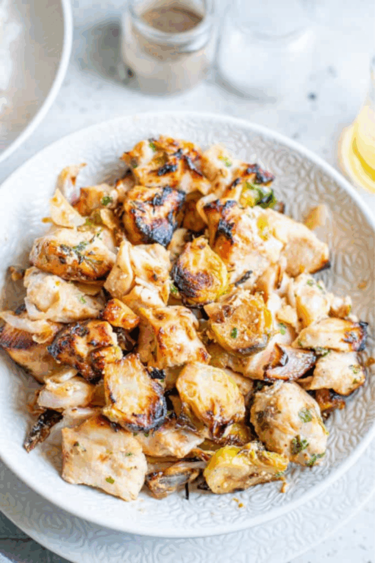 Air fryer chicken and Brussels sprouts cooked together until crispy, golden, and perfectly seasoned for an easy weeknight dinner.