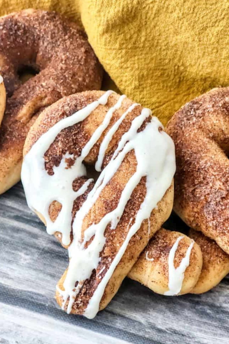 Air Fryer basket with cinnamon bread twists cooking, showcasing the crispy and golden texture.