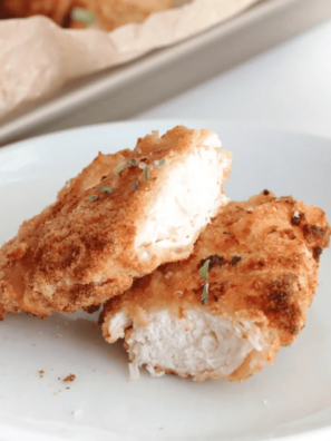 Plate of golden air fryer cornbread crusted chicken tenders made with Jiffy mix, served with honey mustard