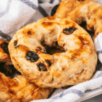 Air Fryer Dunkin' Donuts Cinnamon Raisin Bagel with a golden-brown crust and a sprinkle of cinnamon sugar