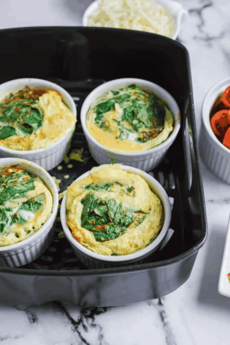 Cooked Air Fryer Egg Bites With Cottage Cheese in the air fryer basket.