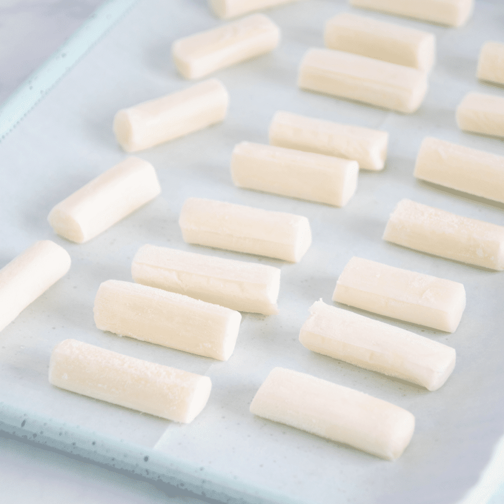 frozen mozzarella sticks on baking tray