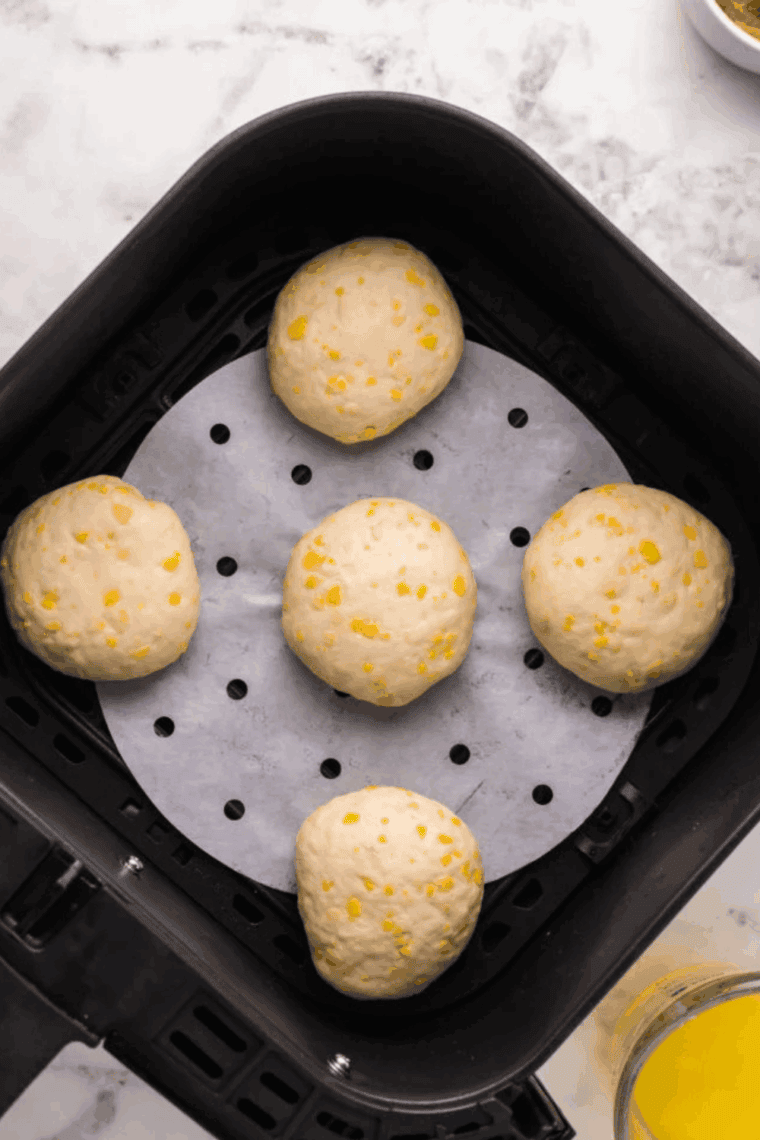 Place Air Fryer Peanut Butter and Jelly Doughnuts in the air fryer basket.