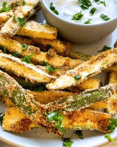 Who doesn't love french fries? Fries are often considered a guilty-pleasure indulgence, but you can still enjoy the deliciousness without feeling guilty! Vegan Zucchini Fries cooked in an air fryer are just as satisfying and taste equally amazing. They're also much healthier than traditional fried french fries, so you don't need to worry about unwanted calories. Plus they only take 15 minutes to make! In this blog post, learn everything you need to bring Vegan Zucchini Fries straight from your kitchen into your home for easy snacking. You'll wow everyone with their crunchy yet delicate texture and subtle flavor of zesty spices that will leave everyone wanting more. Read on if you’re ready for an all vegan deep-fried treat alternative that is sure to tantalize taste buds!