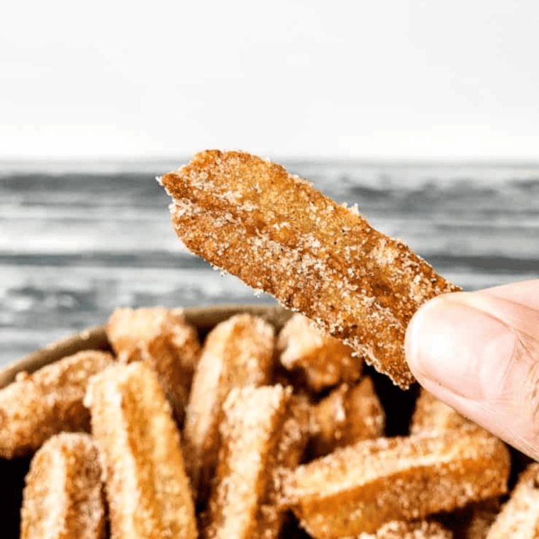 "Disneyland-style churros dusted with cinnamon sugar, crispy on the outside and soft on the inside, served warm and perfect for dipping."