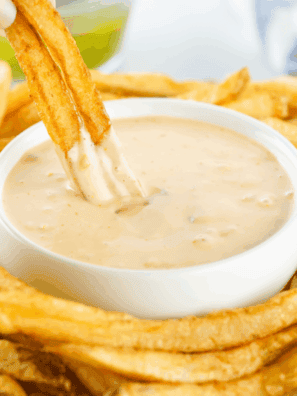 Small bowl of creamy Copycat Freddy&rsquo;s Fry Sauce with a side of golden fries