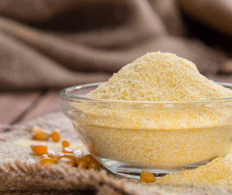 a small bowl of cornmeal for corn muffins
