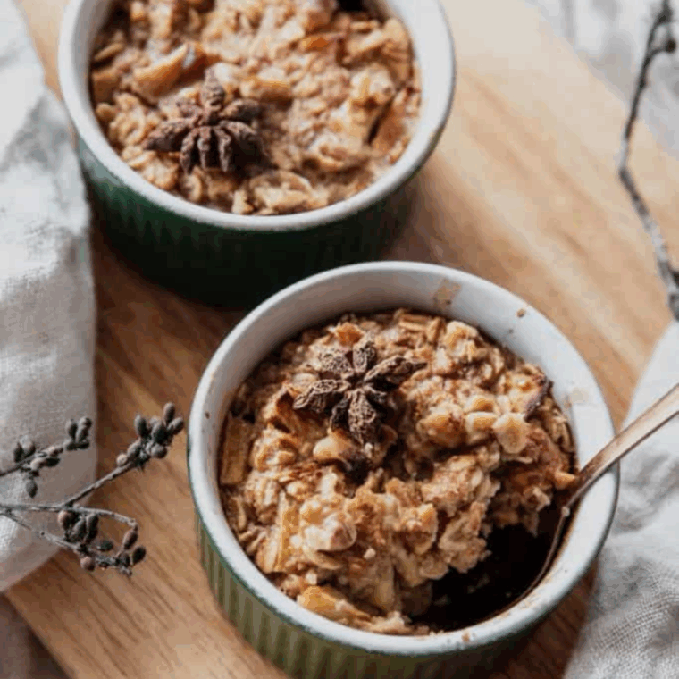 Air fryer baked oatmeal with cinnamon-spiced apples in a bowl, ready to serve.