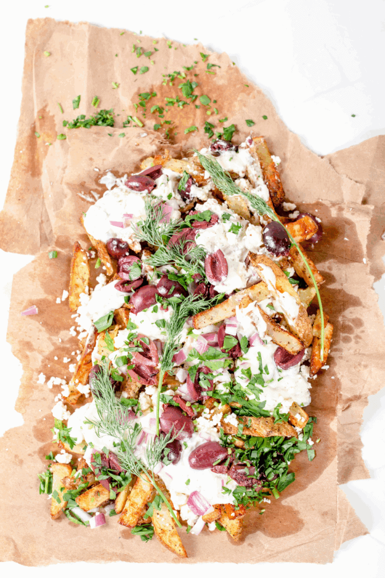 Crispy air fryer Greek fries sprinkled with garlic, oregano, and olive oil.
