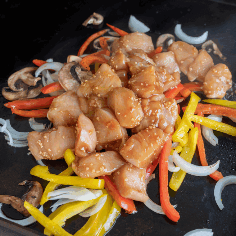 Place chicken and vegetables on the Blackstone Griddle.
