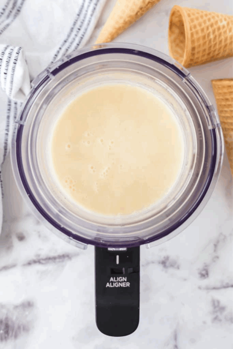 Add the vanilla bean ice cream ingredients into the pint container.
