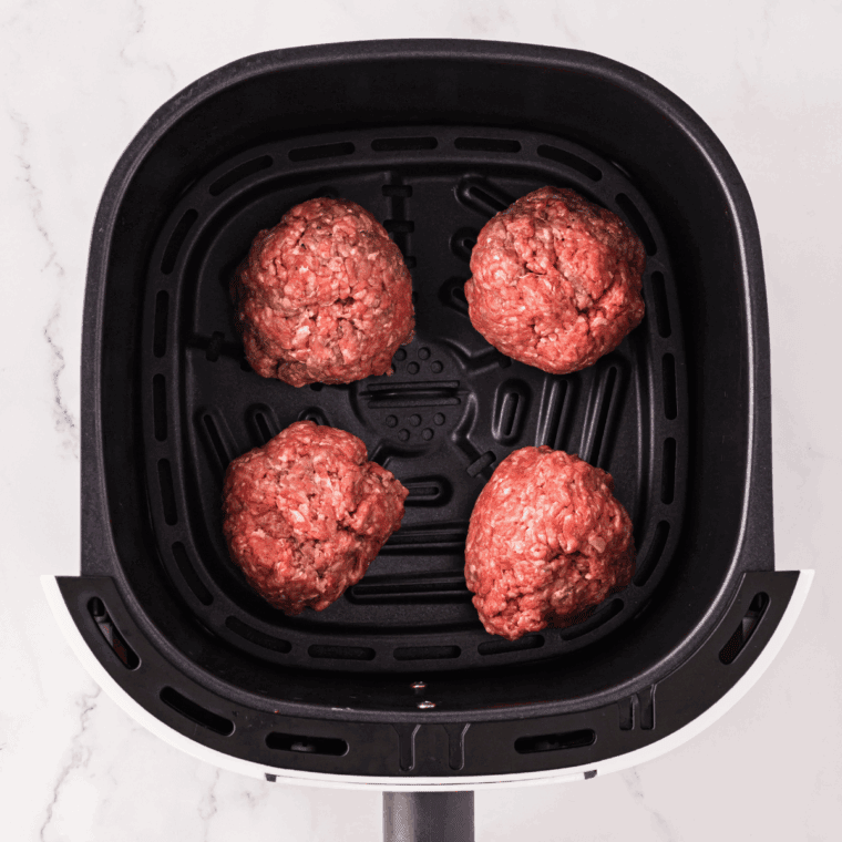 Place the meat into the air fryer basket.