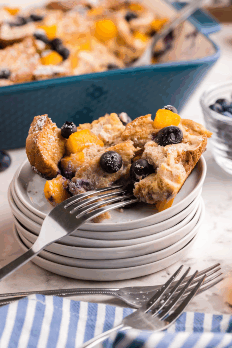 Plate of Sourdough French Toast Casserole with fruit.