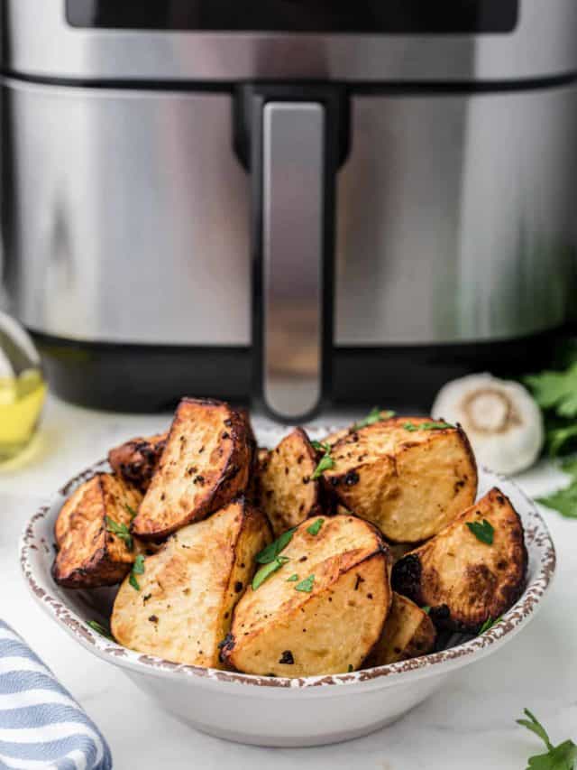 Prep the Potatoes: Wash and scrub the potatoes to remove any dirt or debris. You can peel them if you prefer, but leaving the skin on adds texture and flavor. Cut the potatoes into evenly-sized pieces, typically around 1-inch cubes. 2. Season the Potatoes: In a large bowl, combine the potato cubes with olive oil, salt, black pepper, garlic powder, and paprika. Use your hands or a spoon to toss the potatoes, ensuring they are evenly coated with the seasonings. Feel free to add any optional seasonings or herbs at this stage for extra flavor. 3. Preheat the Instant Pot Air Fryer: Place the Instant Pot Air Fryer Lid on your Instant Pot and preheat it according to the manufacturer's instructions. This usually involves selecting the air fryer function and setting the temperature. 4. Arrange the Potatoes: Spread the seasoned potato cubes in a single layer in the air fryer basket. Avoid overcrowding, as this can hinder proper crisping. If needed, cook them in batches. 5. Air Fry the Potatoes: Set the Instant Pot to air fry mode at a temperature of around 380-400°F (190-200°C). Cook the potatoes for about 20-25 minutes, flipping them halfway through to ensure even browning. Cooking times may vary based on your specific appliance and the size of the potato cubes. 6. Check for Doneness: The roasted potatoes are done when they are crispy and golden brown on the outside, and tender on the inside. Pierce them with a fork or knife to check for doneness. 7. Optional: Garnish and Serve: Once the potatoes are perfectly roasted, you can garnish them with freshly chopped herbs, grated Parmesan cheese, or a sprinkle of lemon zest for added flavor and presentation. 8. Serve Hot: Transfer your Instant Pot Air Fryer Roasted Potatoes to a serving dish and enjoy them hot as a side dish, brunch addition, or snack. These roasted potatoes are versatile and make a