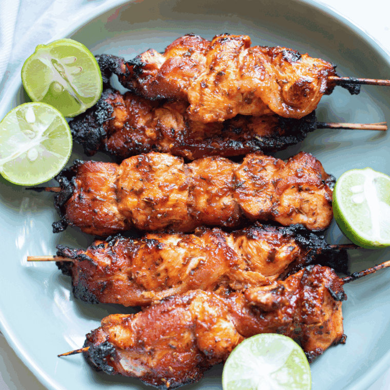Crispy Air Fryer Chicken Thigh Bites, golden brown on the outside and tender on the inside, served with dipping sauce.