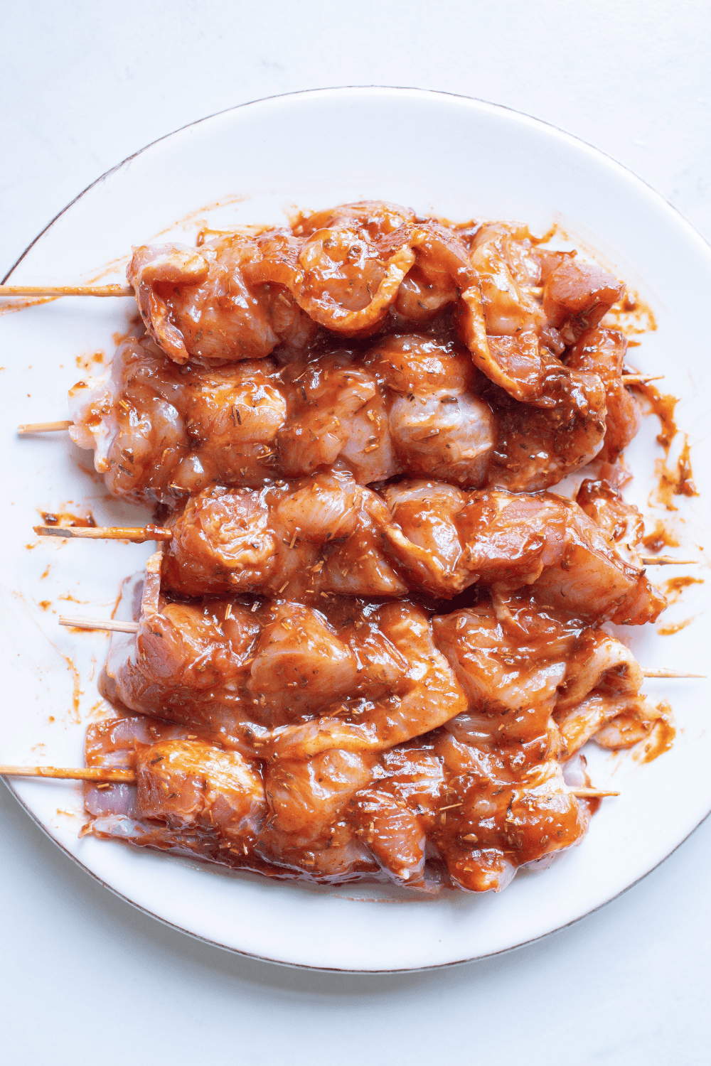 Seasoned chicken thighs with seasoning.