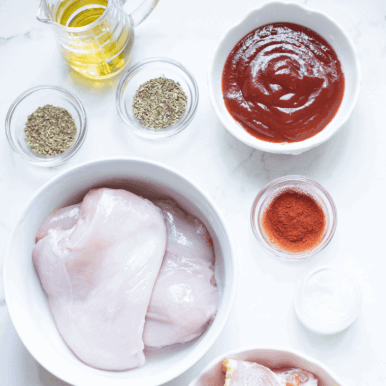 Ingredients needed for Air Fryer Chicken Thigh Bites on kitchen table.