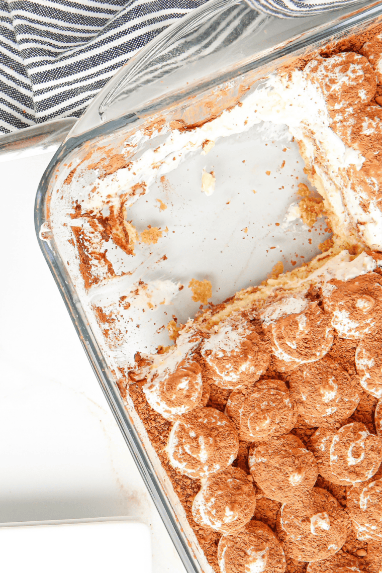 Freshly baked, golden homemade ladyfingers cooling on parchment paper from the air fryer.