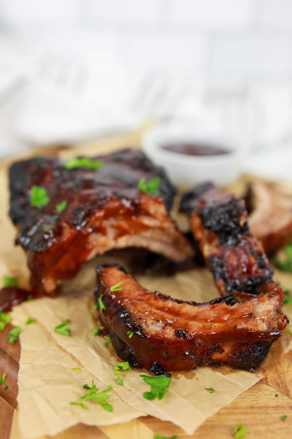 Air Fryer BBQ Ribs are incredibly juicy, flavorful, and simple to make. Tender meat with caramelized barbecue sauce makes cooking ribs in an air fryer a family favorite!