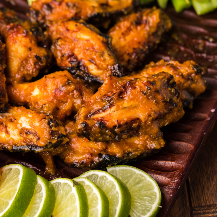 Deliciously arranged Air Fryer Spicy Apricot Glazed Chicken Wings on a plate, perfect for game day or gatherings, highlighting the bold flavors of the sweet and spicy glaze.