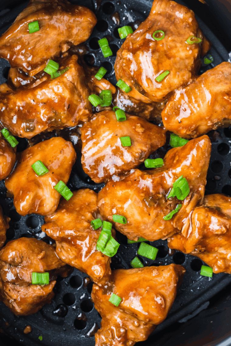 Air fryer Benihana-style teriyaki chicken served over steamed rice with sesame seeds and chopped green onions.